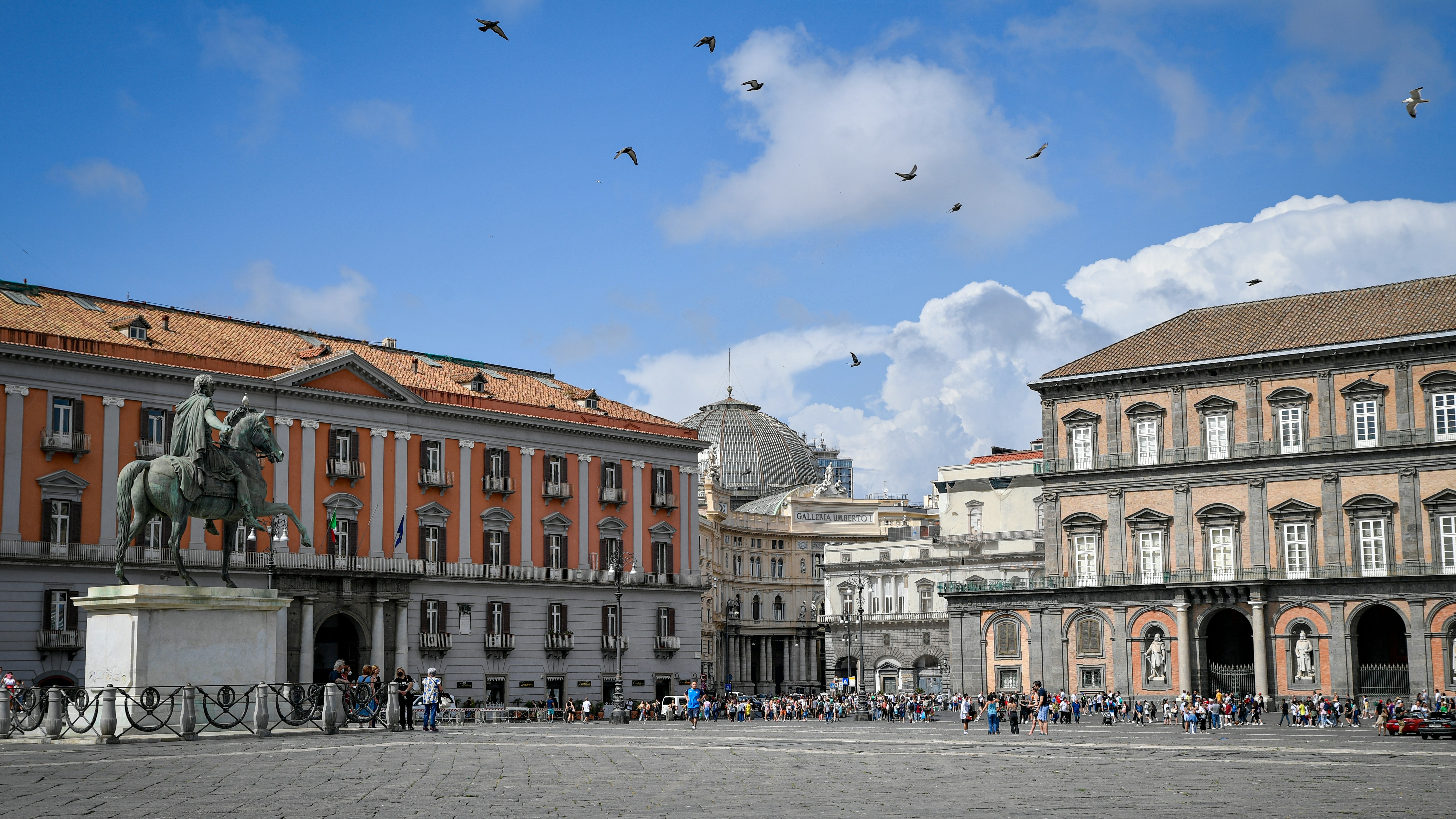 Piazza del plebiscito with equestrian statue and buildings.