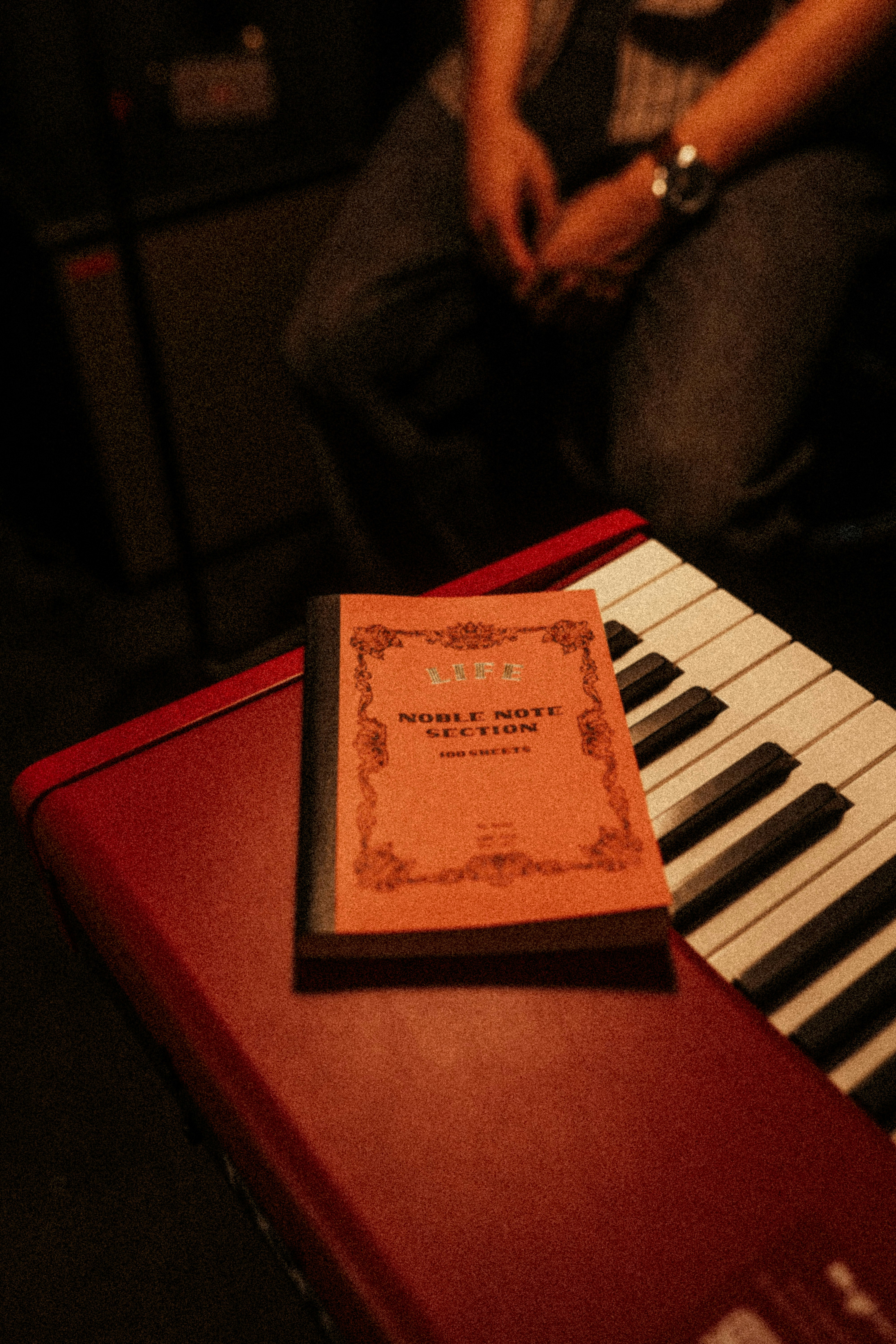A small book rests on a keyboard.