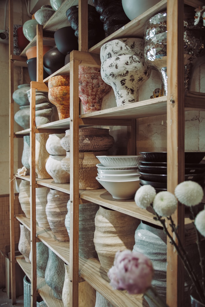 Pottery studio interior with ceramic pieces on shelves
