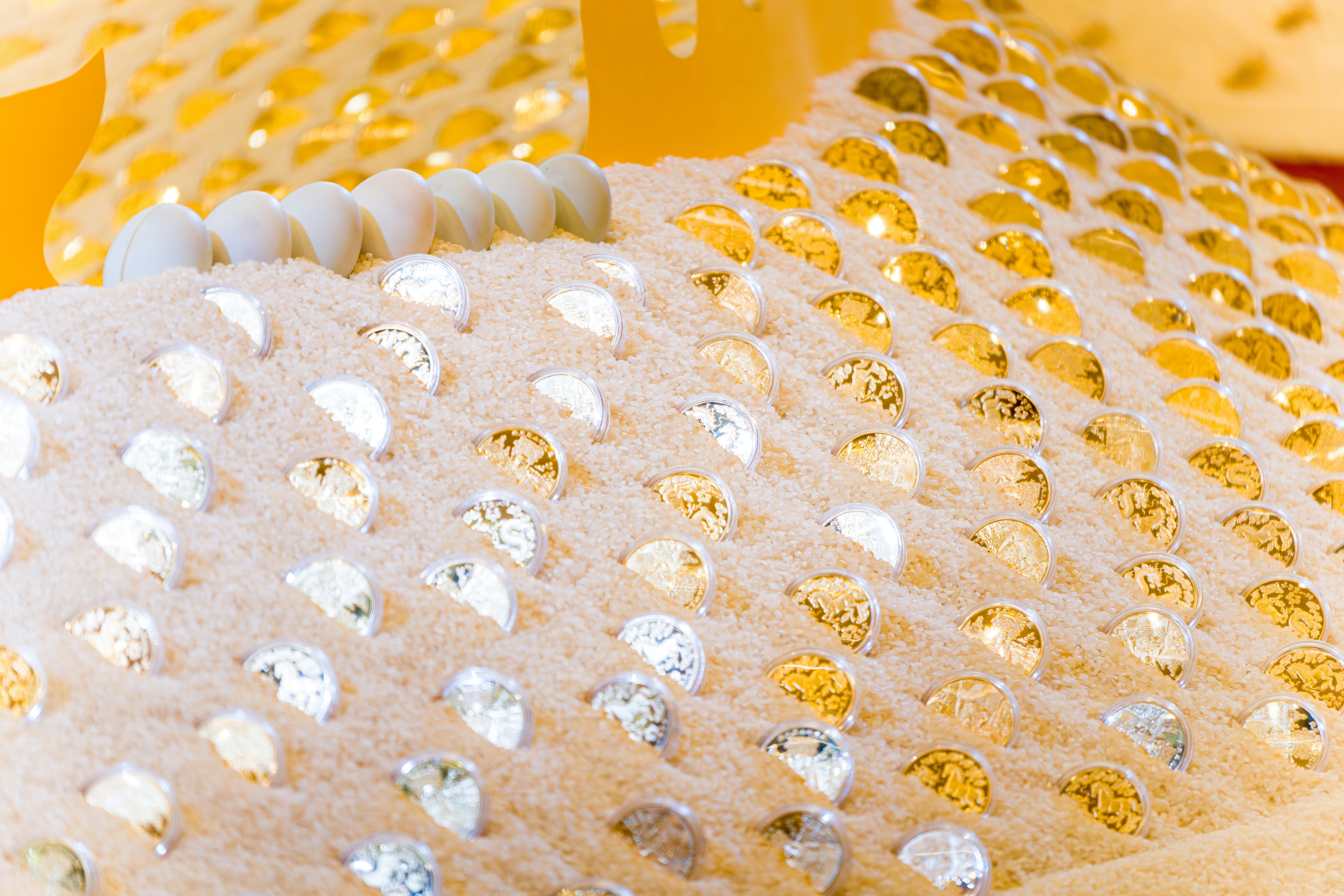 Close-up of a textured surface with gold and silver embellishments.