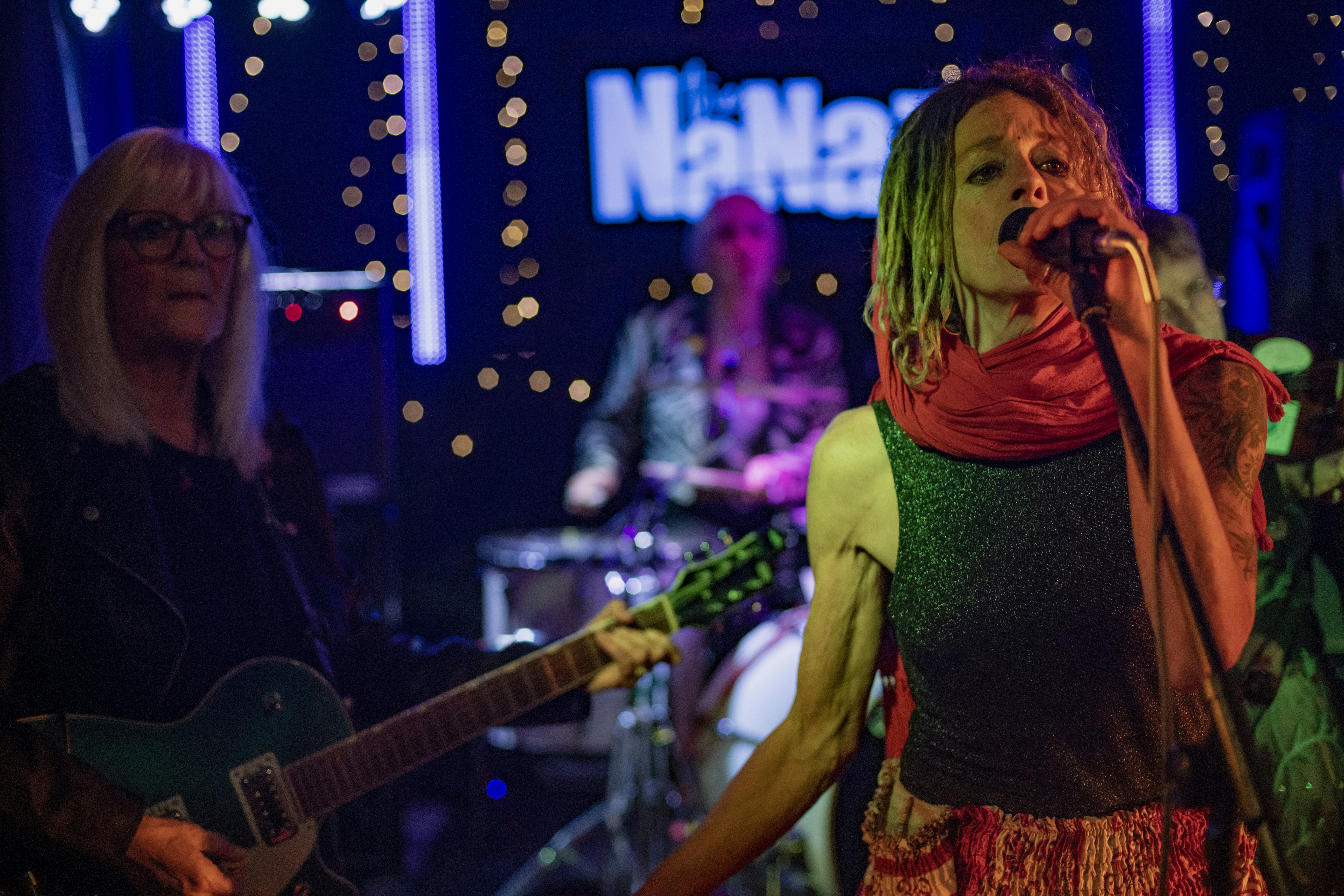A band performing live music on a stage.