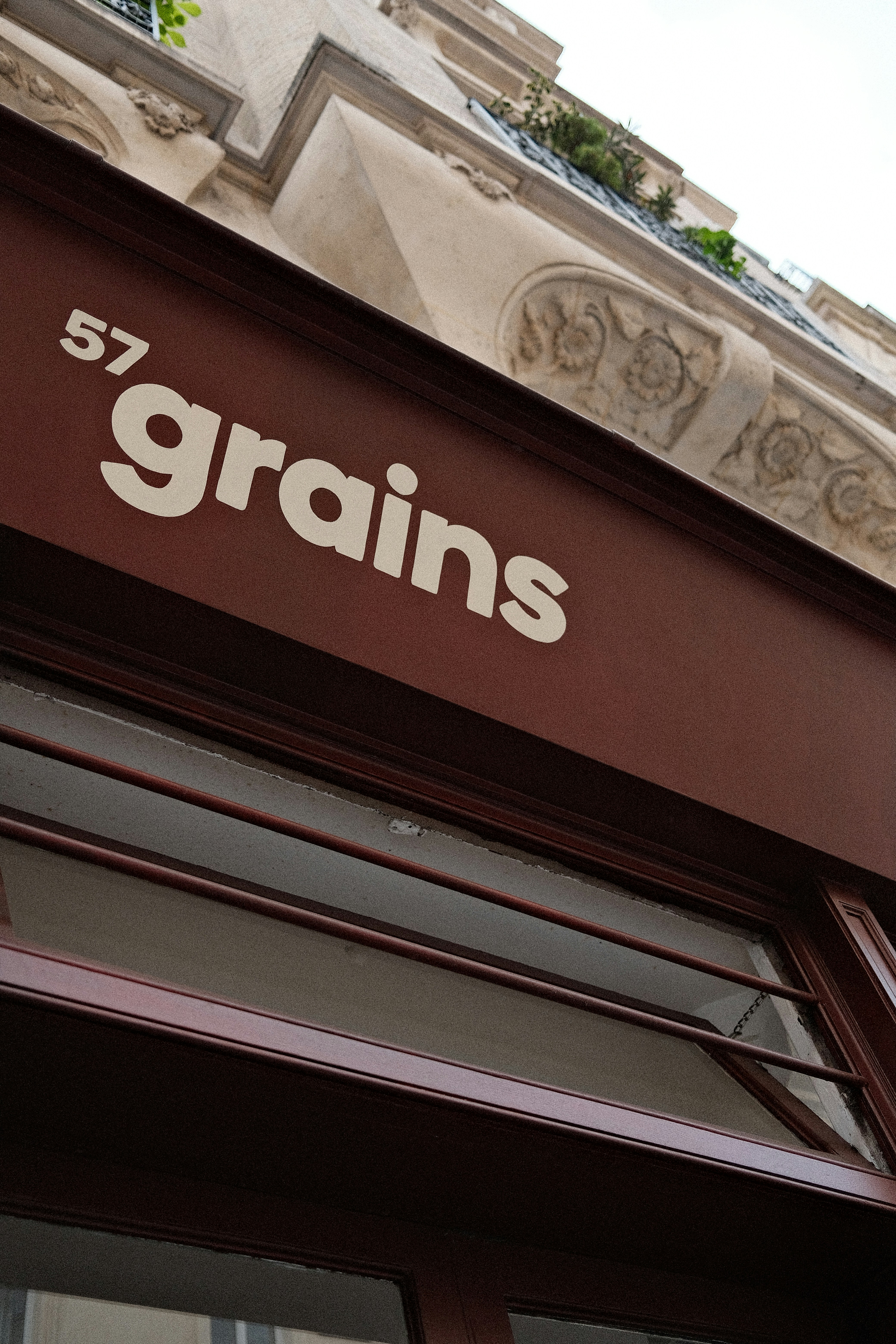 Building facade with "57 grains" sign