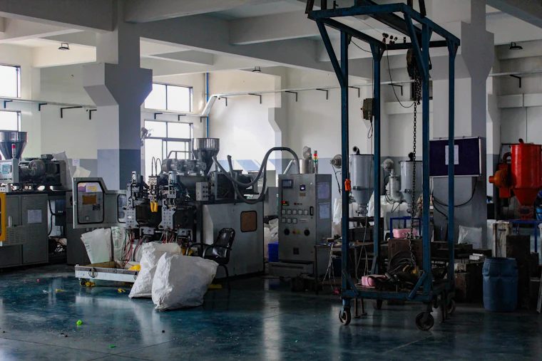 Interior of a molding plant with presses and material handling