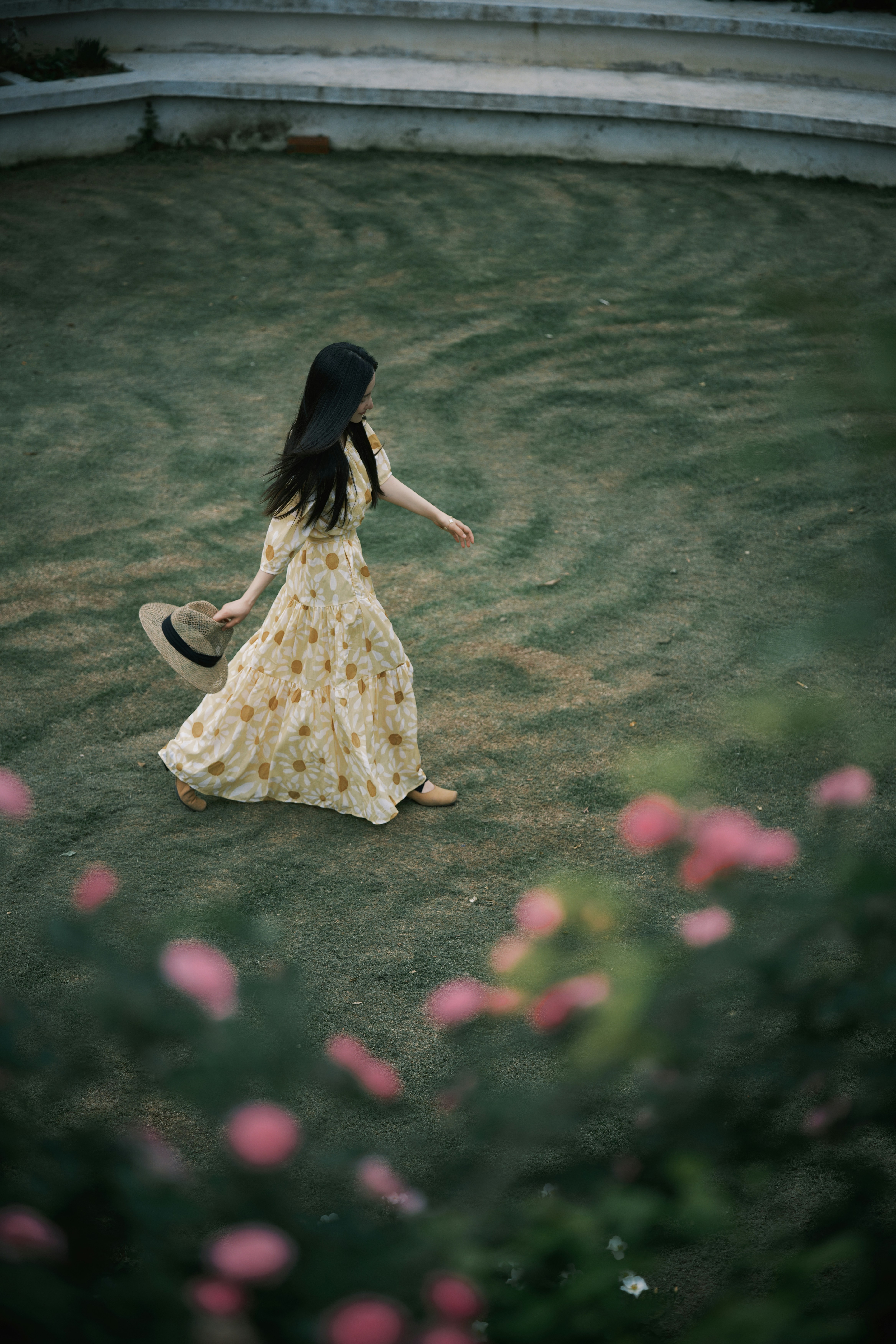 Woman in floral dress walks across grassy field photo – Free Garden ...