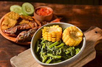 Fried fish with corn and greens