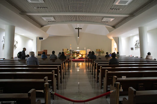 People seated in pews before a service