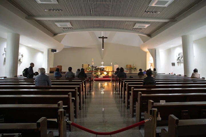 Families seated in pews facing a sanctuary altar