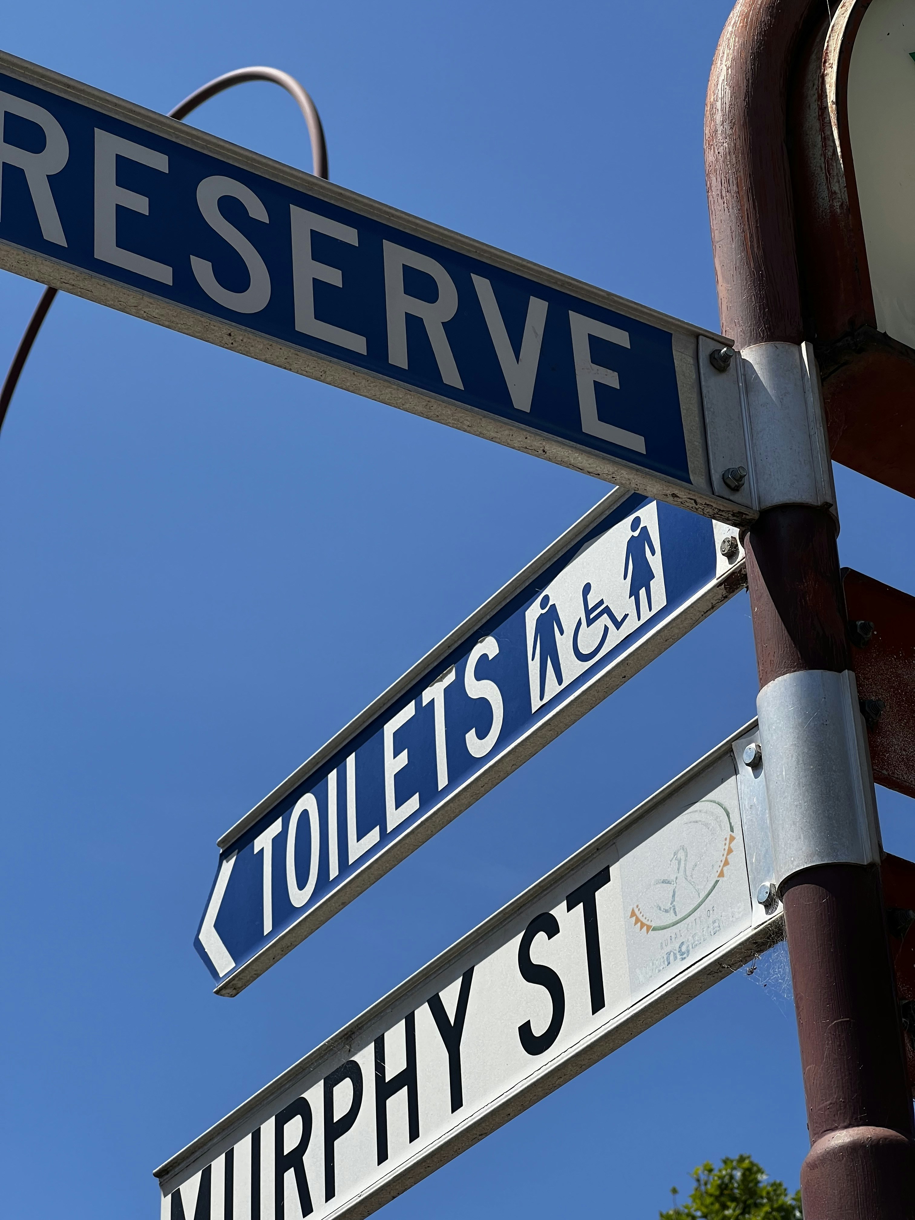 Street signs for reserve, toilets, and murphy st.
