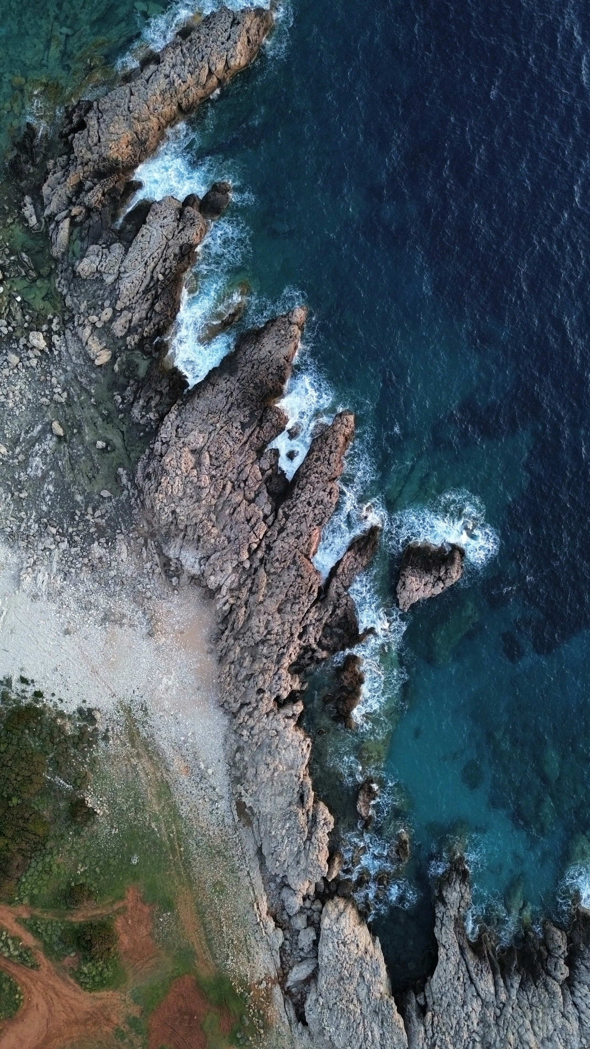 Rocky coastline with waves crashing against shore