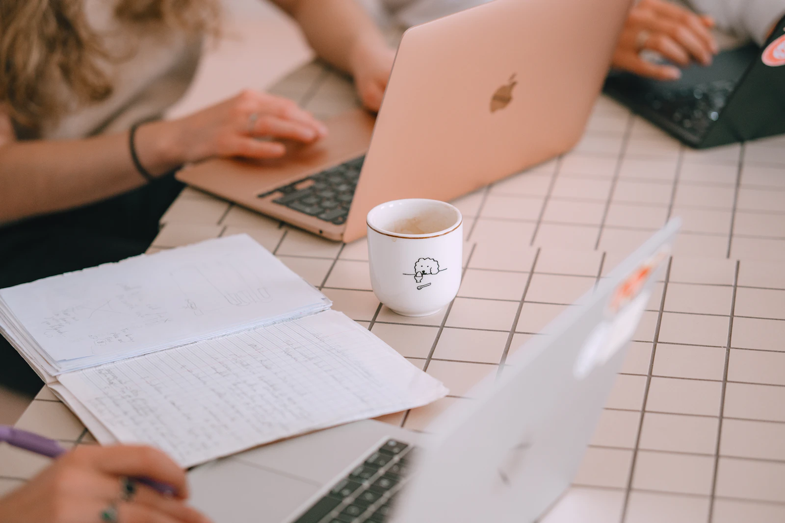 Team working with laptops and notes while planning a digital affiliate content strategy