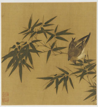 A bird perches on a bamboo branch.