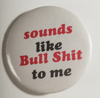 White button with red and black text