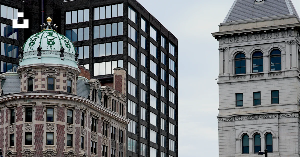 Glass Line Scale Modern and historic buildings line a city street - Free Photo on Unsplash