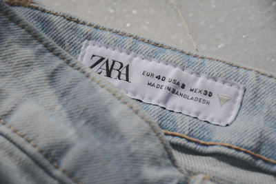 Close-up of a zara clothing label made in bangladesh.