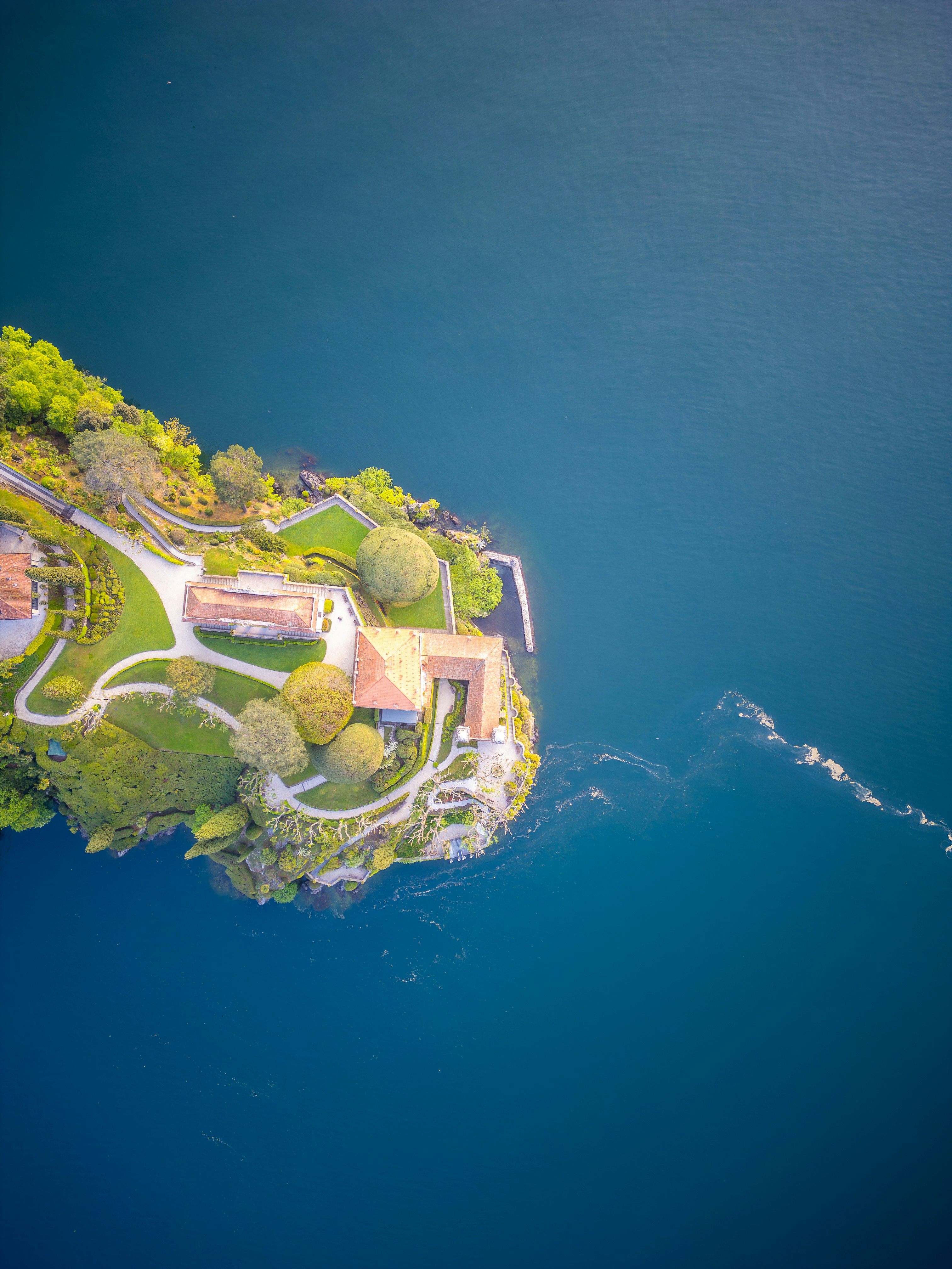 Aerial view of a house on a small island.