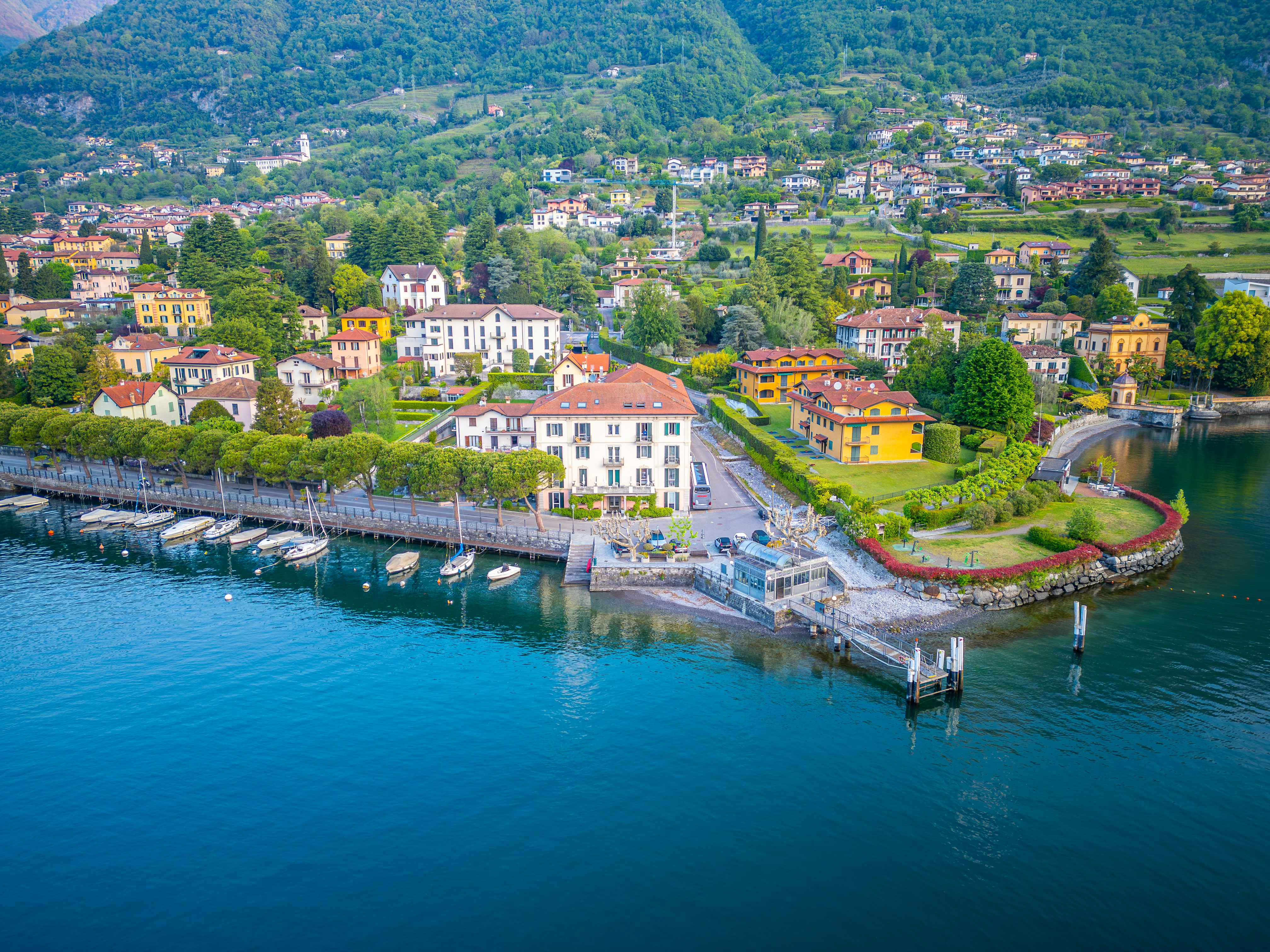 Colorful village nestled on a blue lake shore