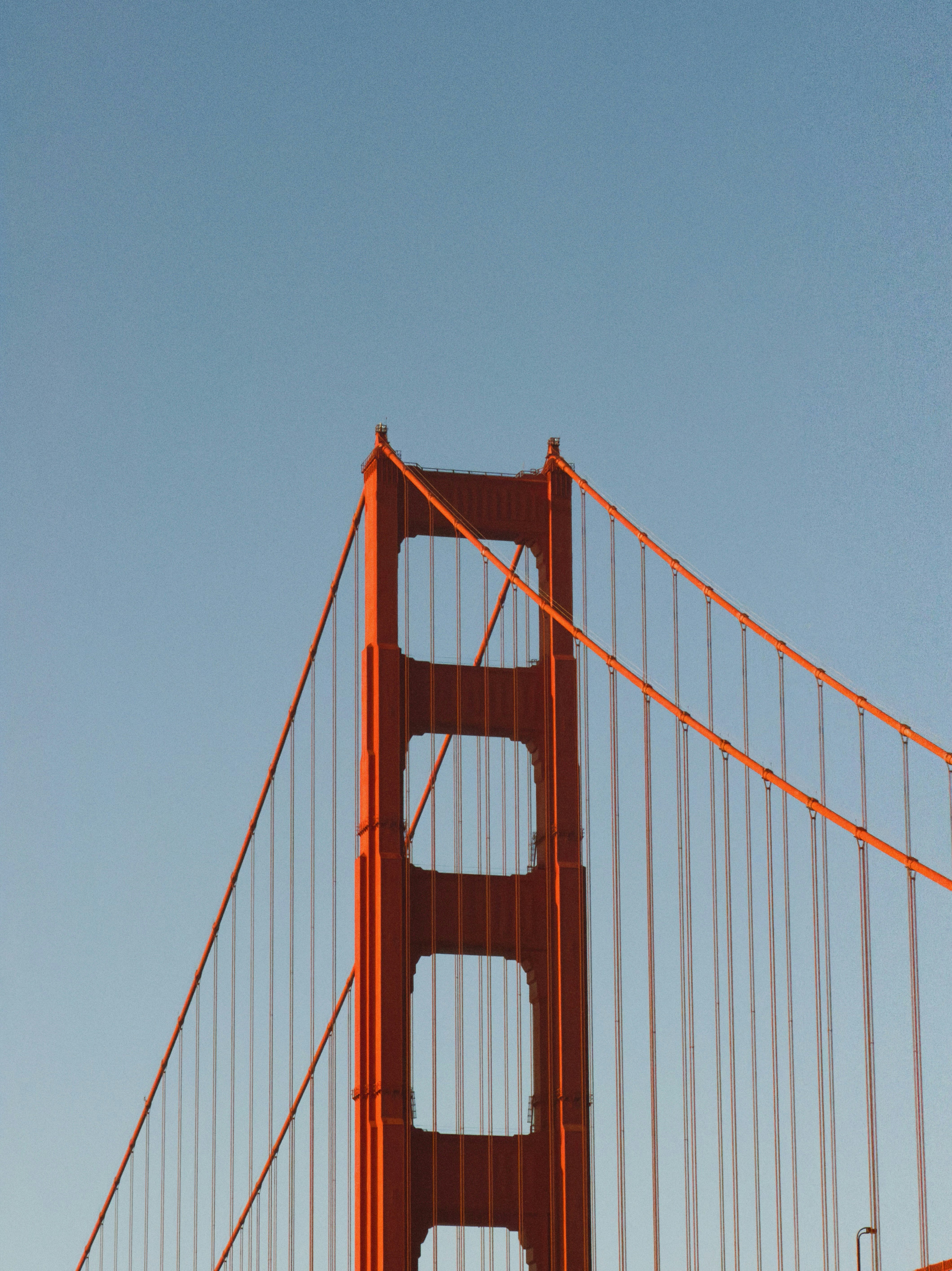 Close-up of the golden gate bridge tower against sky