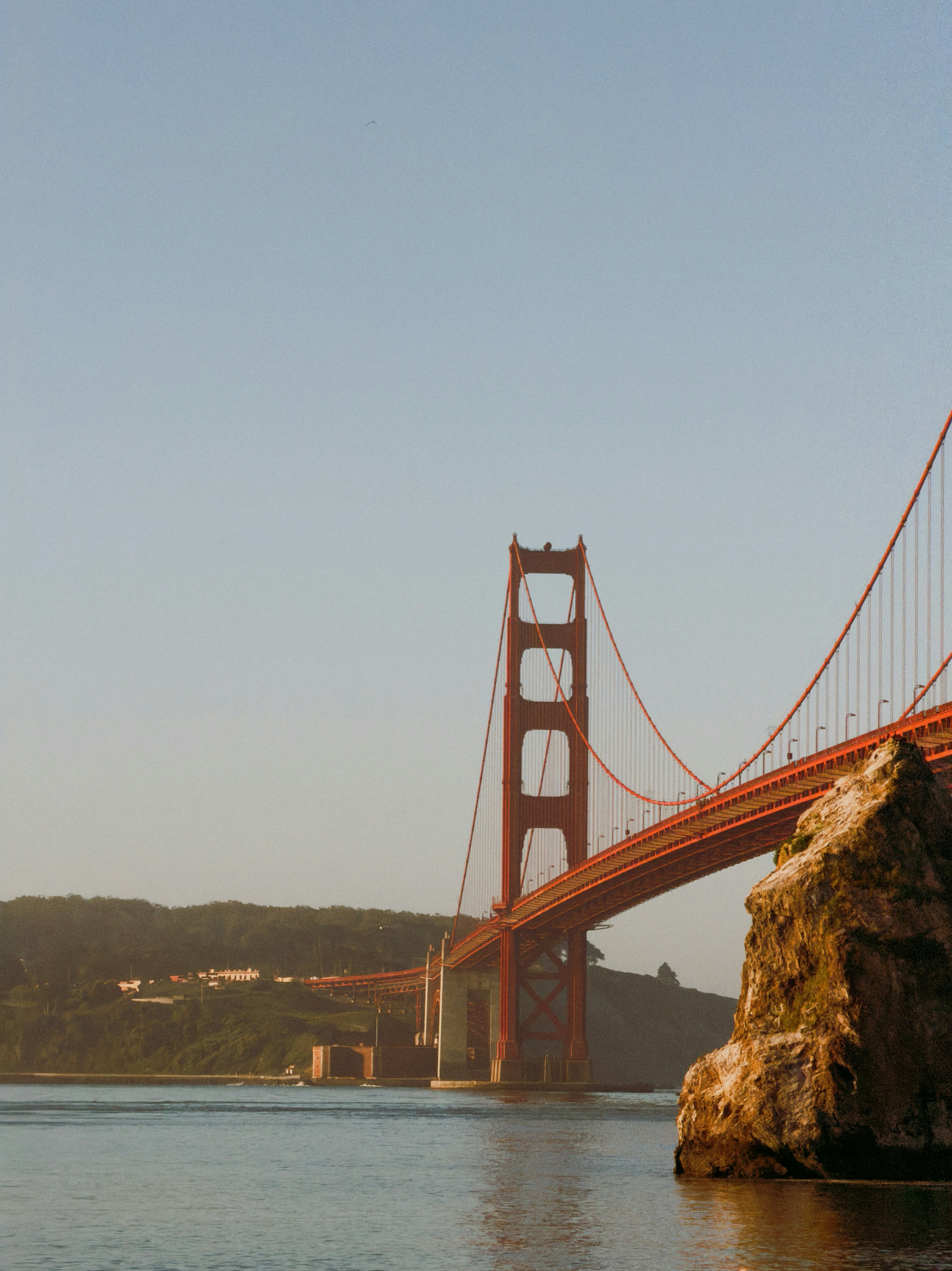 Golden gate bridge over calm blue water