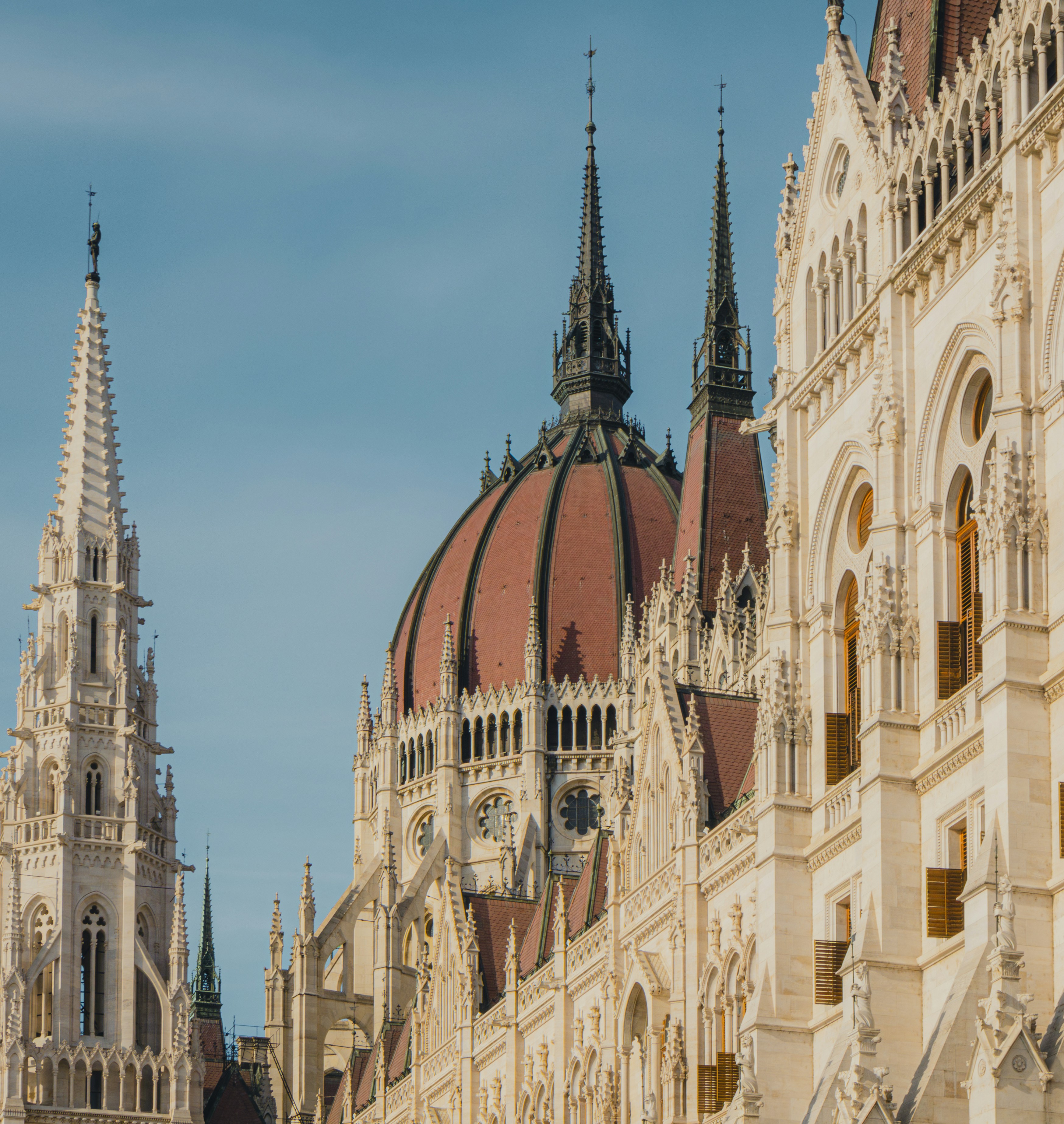 Ornate Gothic spires and a red dome on the Hungarian Parliament Building