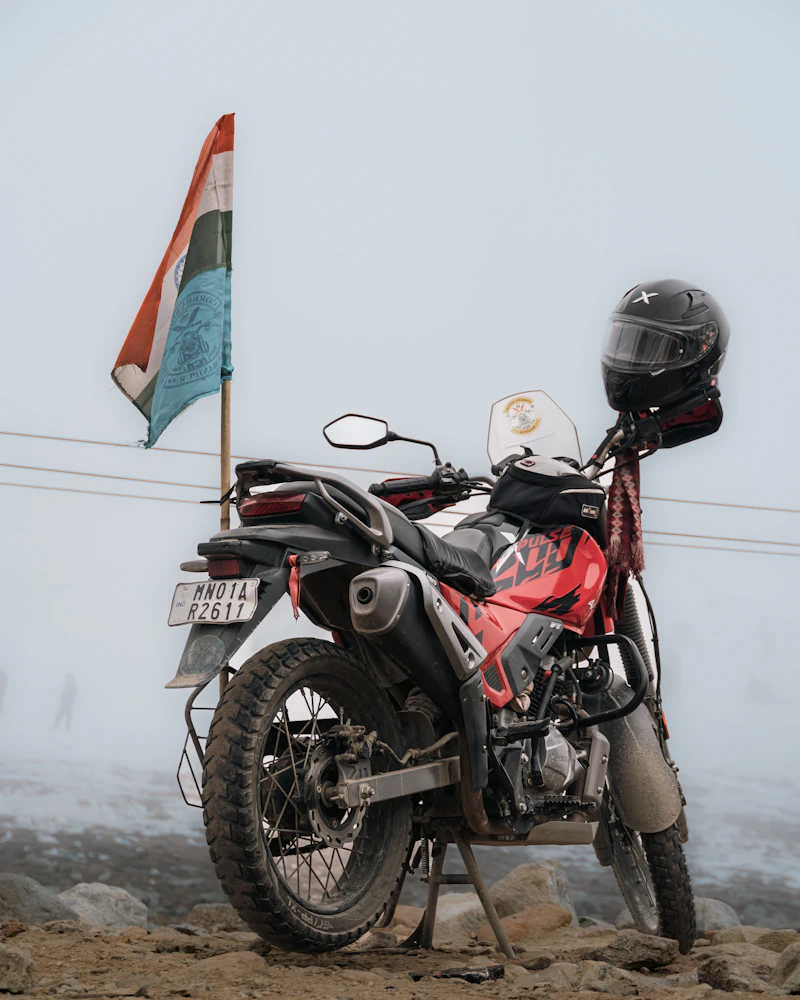 Motorcycle near the Indian flag in fog