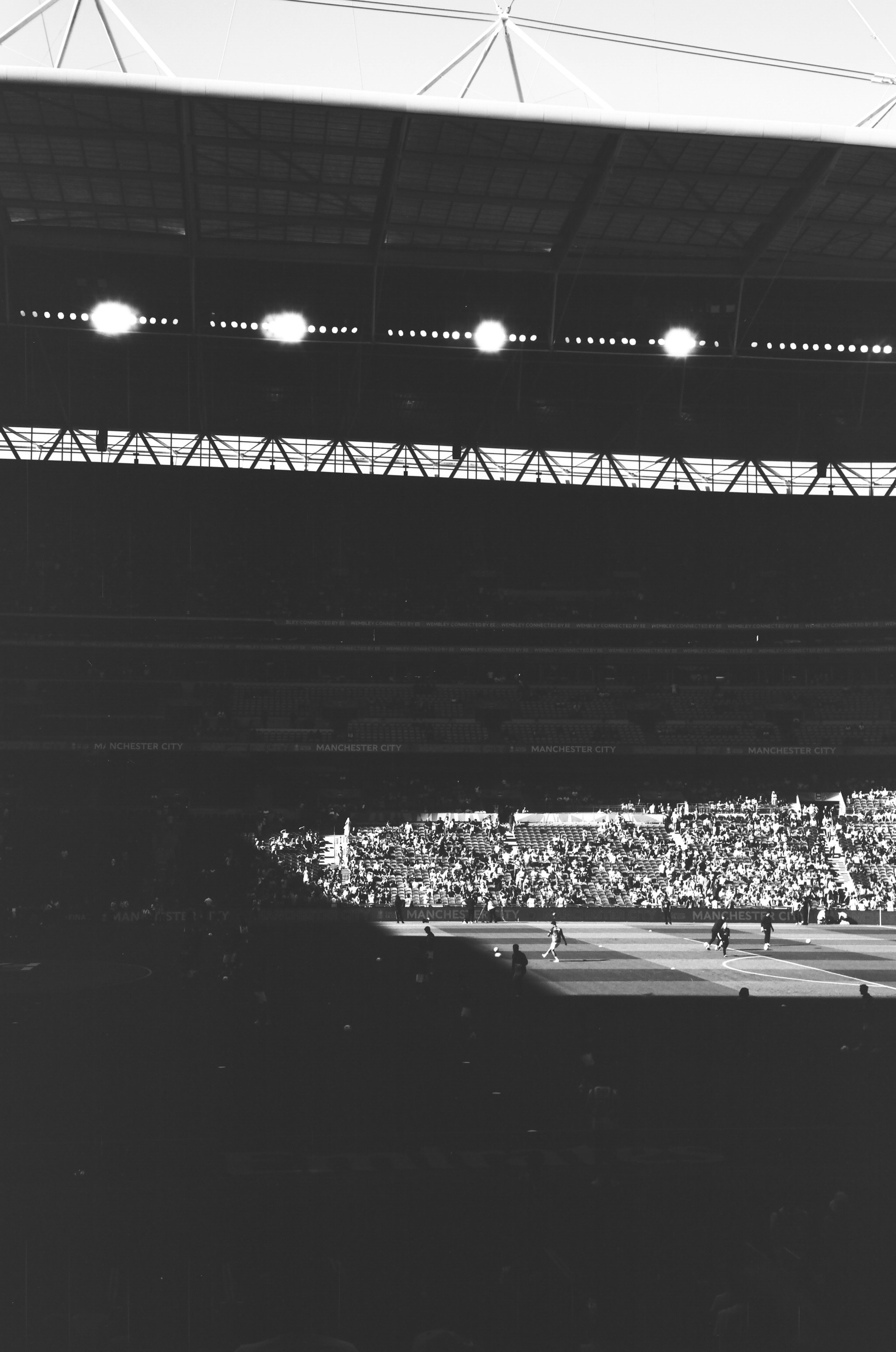 Crowded stadium with a soccer game in progress.