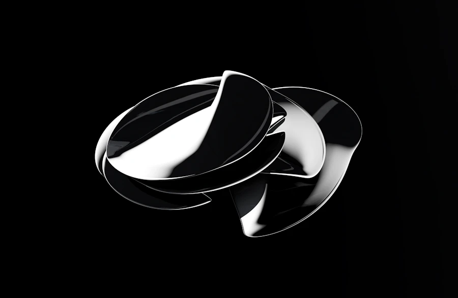 A folded chrome disc on black