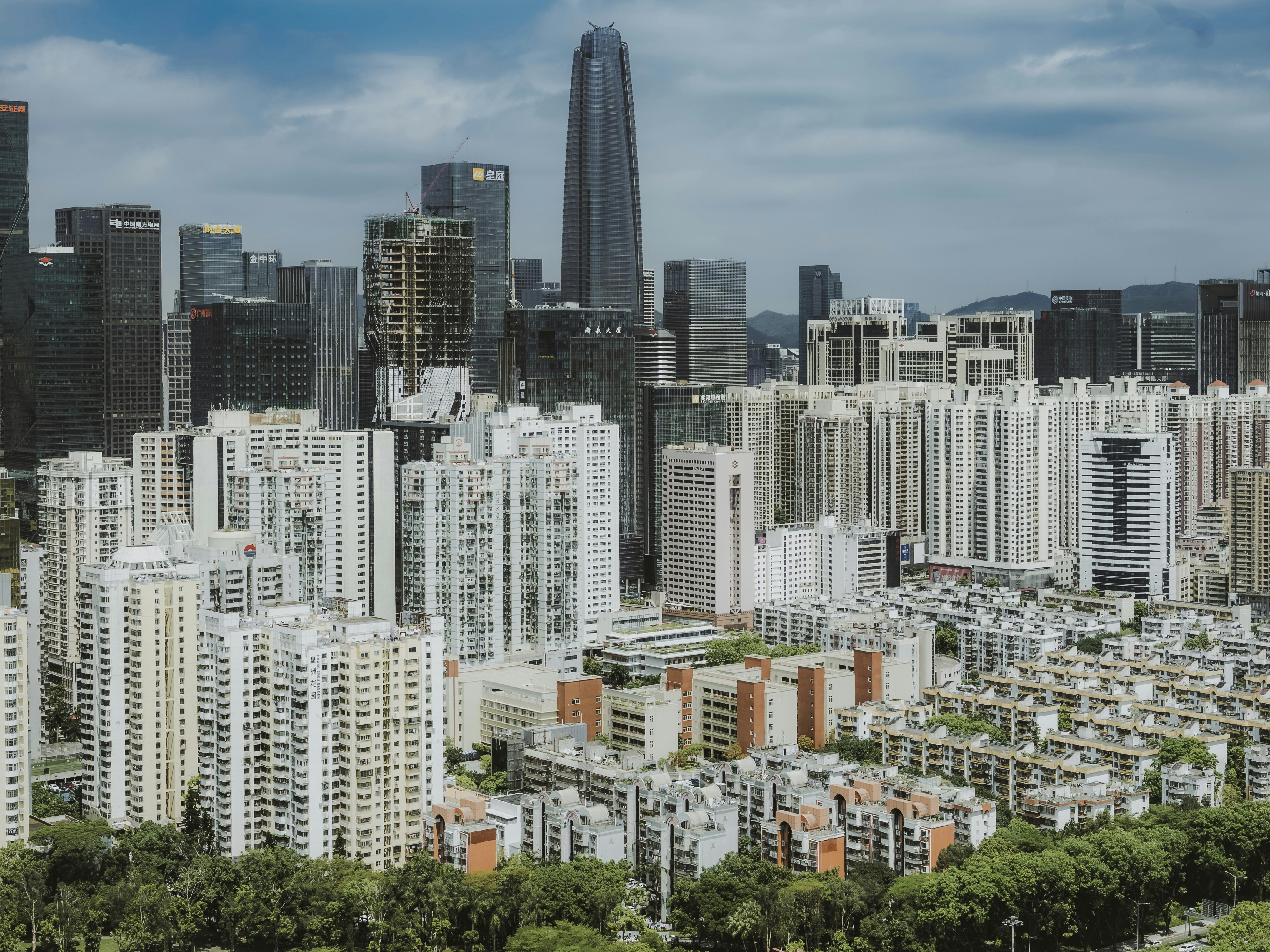 Modern cityscape with dense residential buildings and skyscrapers.