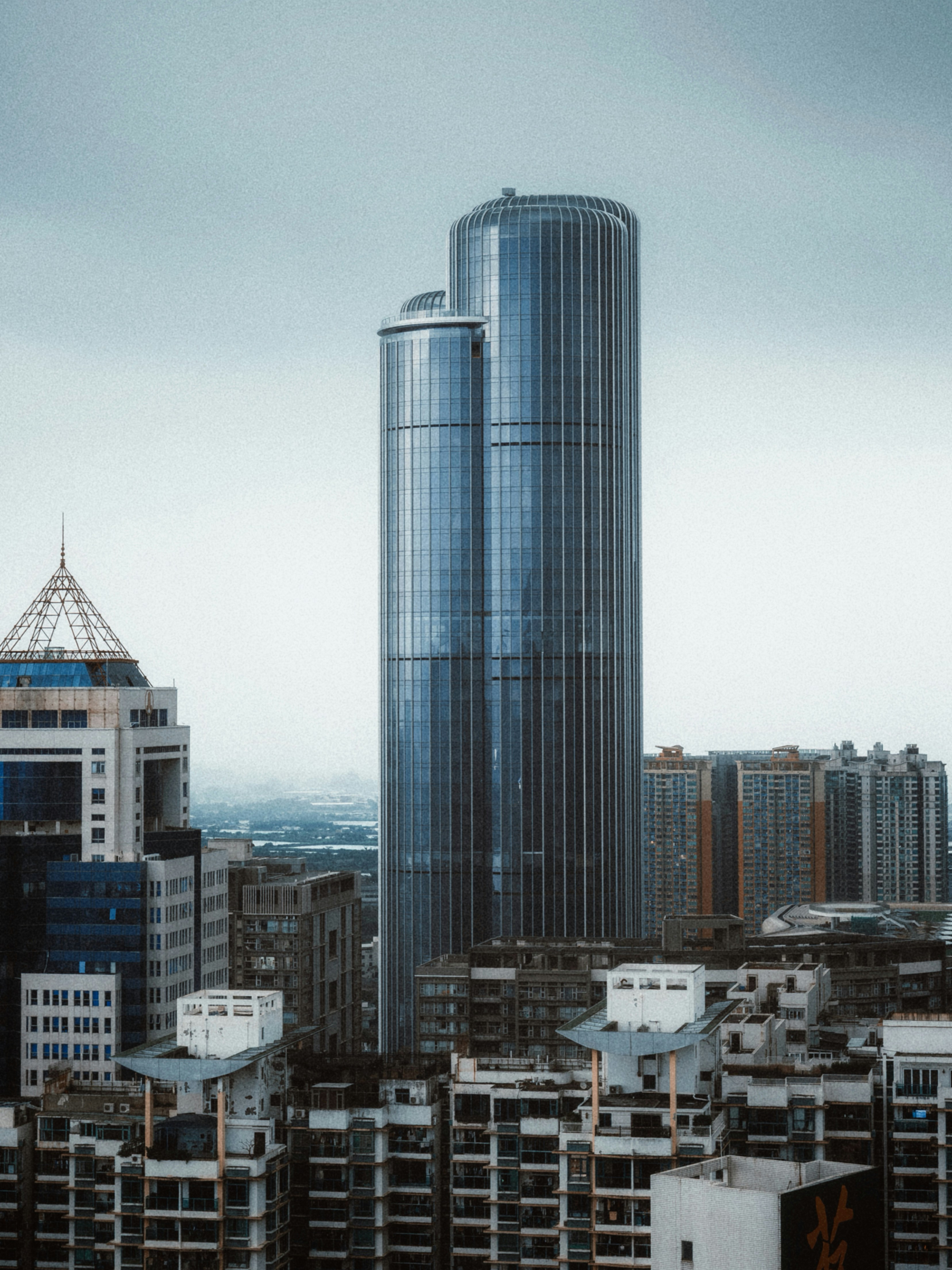 Modern skyscrapers in a dense urban cityscape.