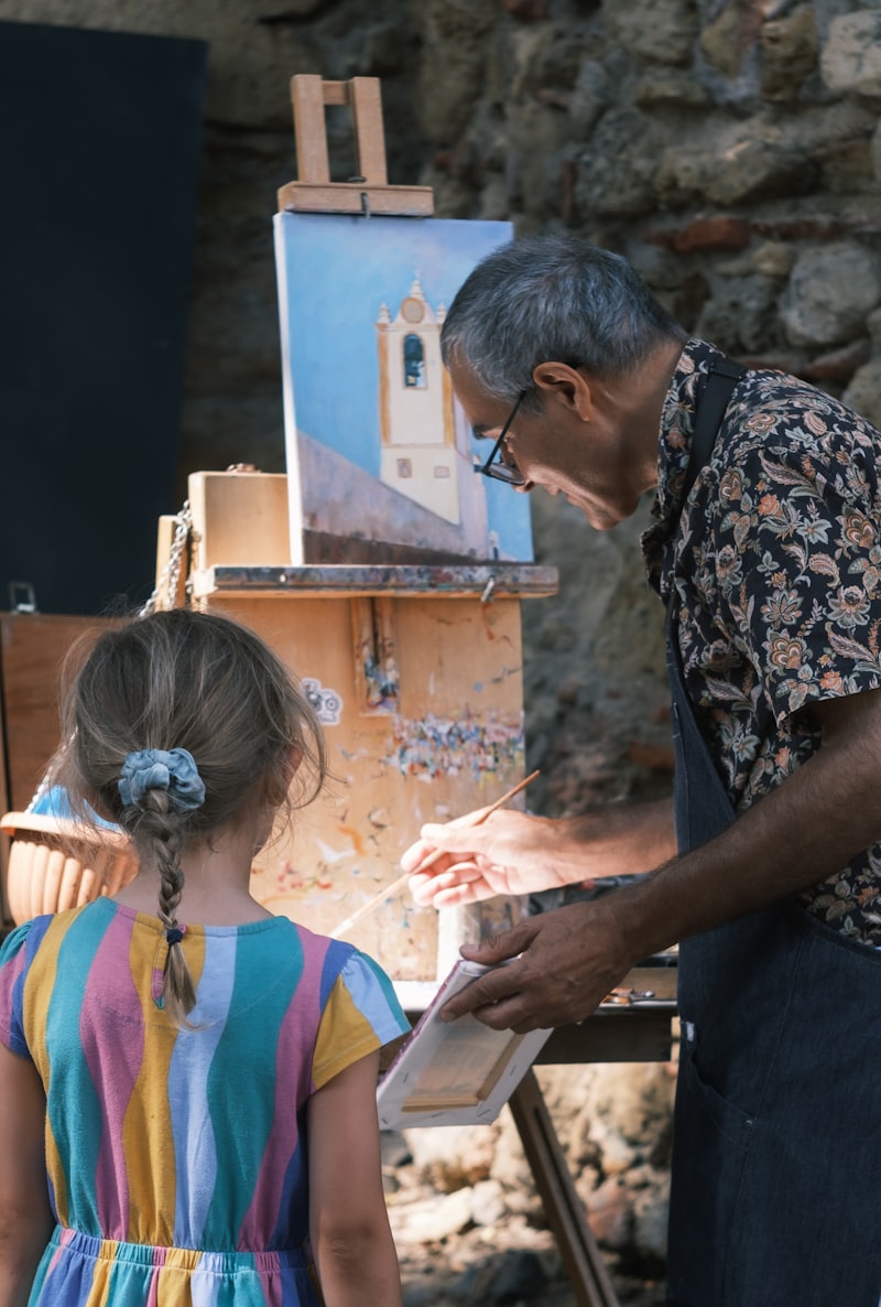 Senior painter sharing his craft at an easel, demonstrating the joy of creative expression after 65