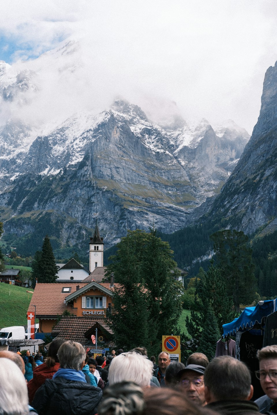 Grindelwald village nestled in the valley at the base of snowy mountains