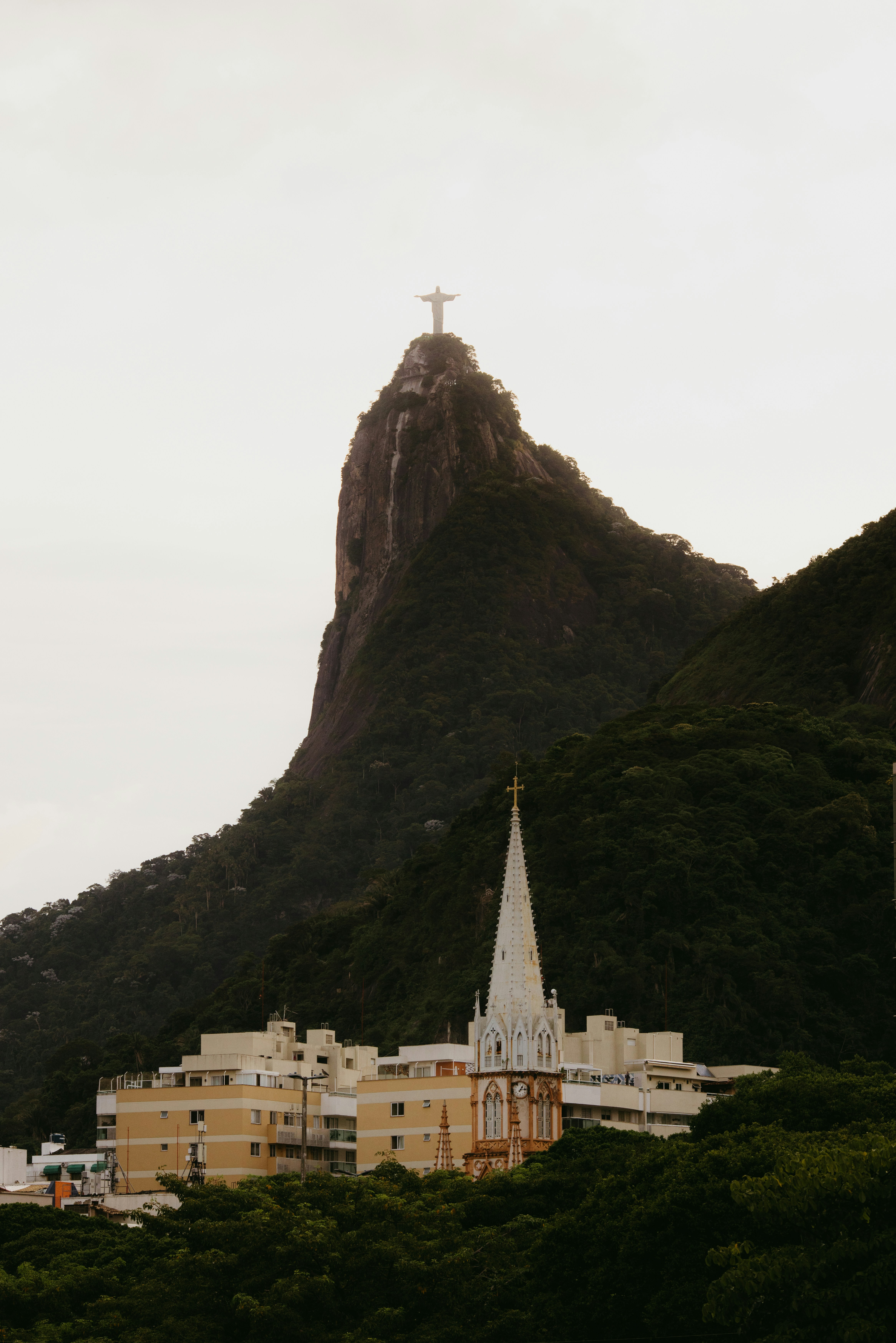 Christ the redeemer statue overlooks rio de janeiro city.
