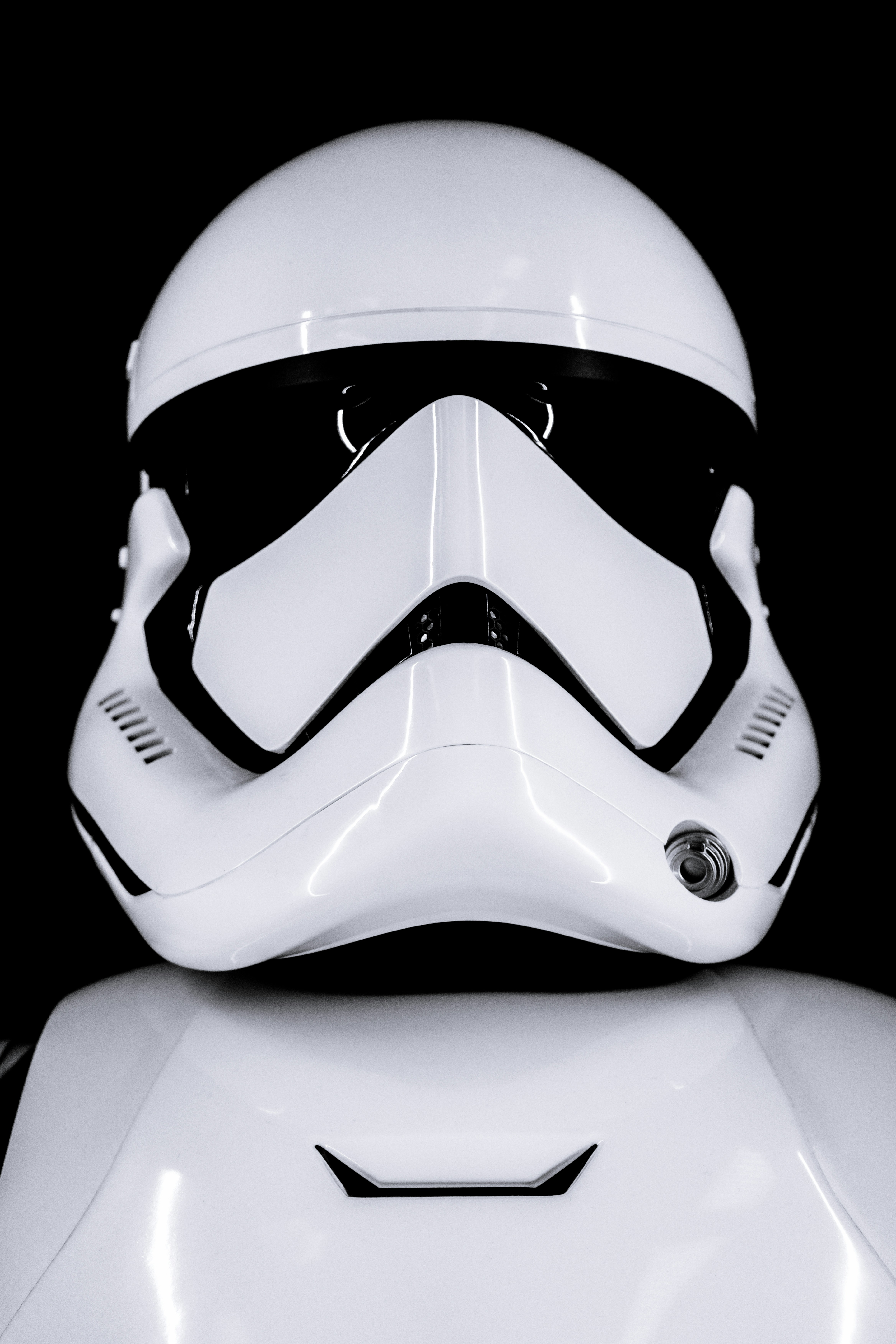 A white stormtrooper helmet against a black background