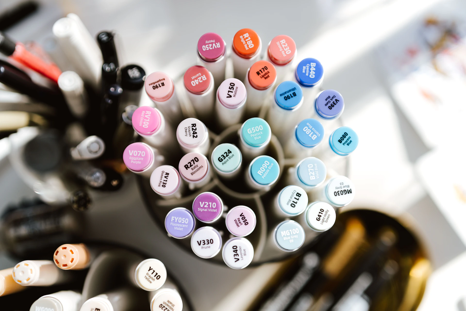 Assortment of colorful markers in a container