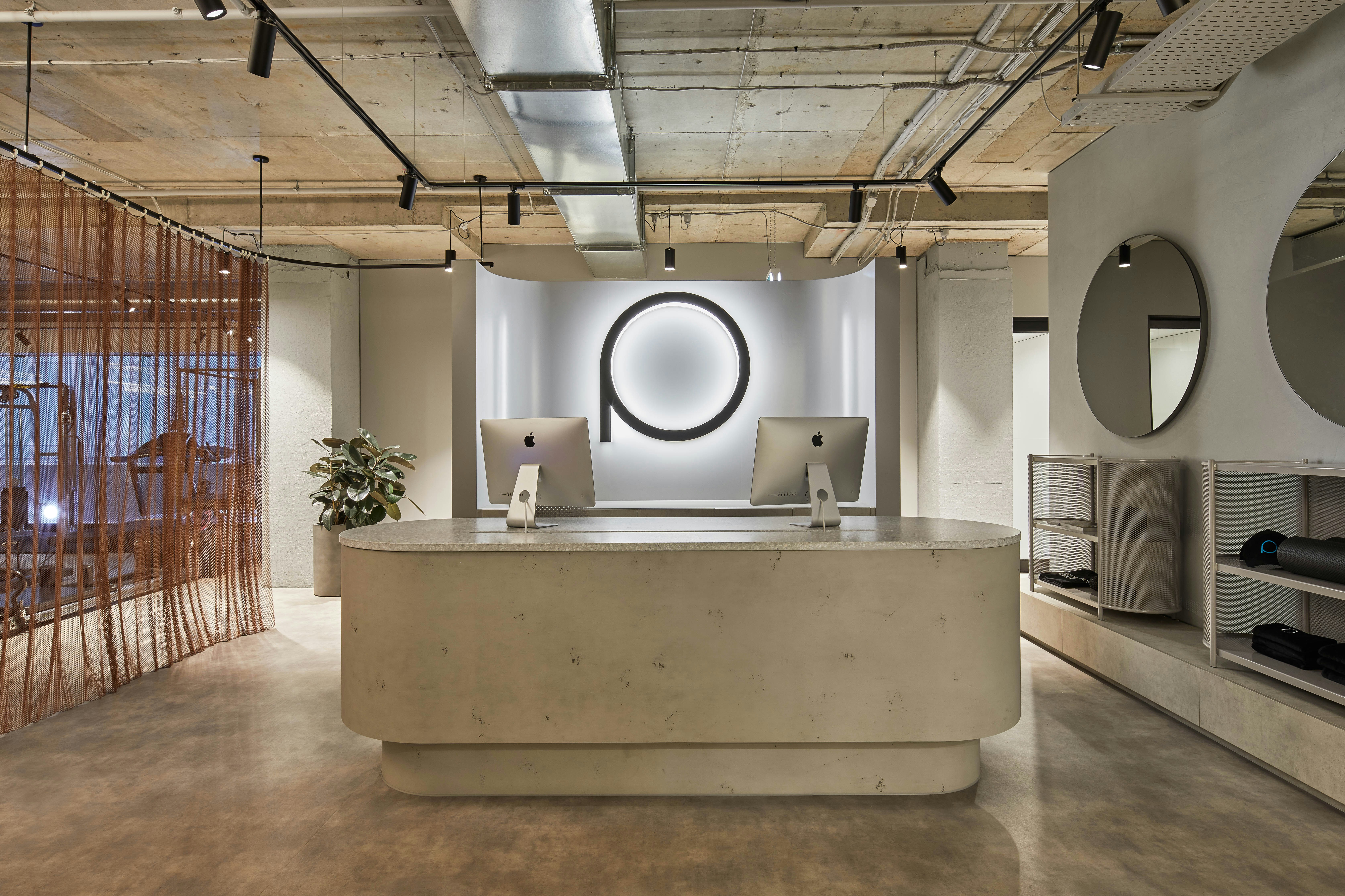 Modern reception desk with minimalist decor and logo