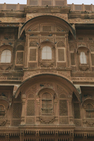 Intricate sandstone facade of an old indian building