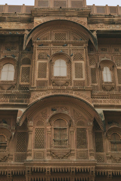 Intricate sandstone facade of an old indian building