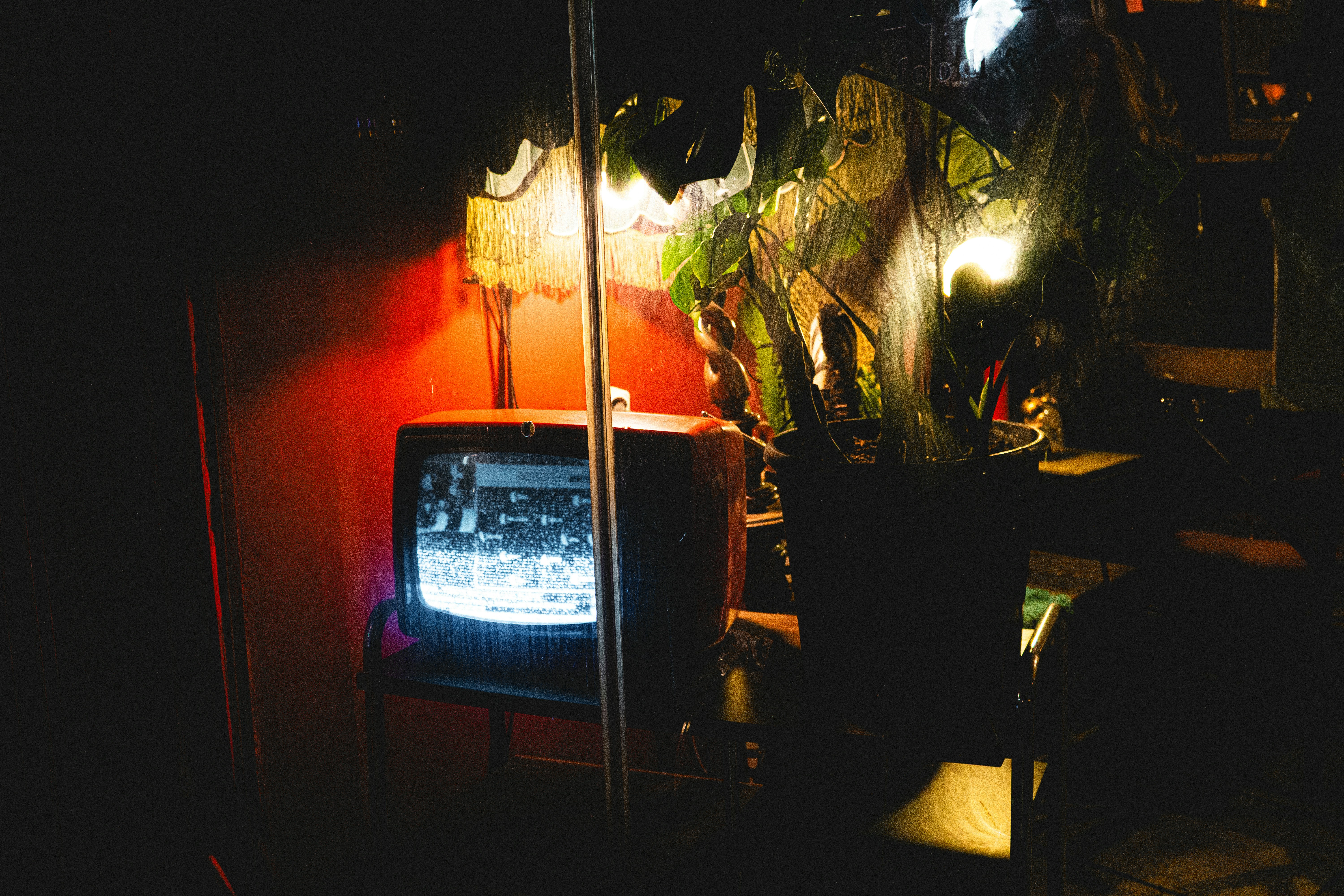 Vintage CRT screen glowing in a dark room