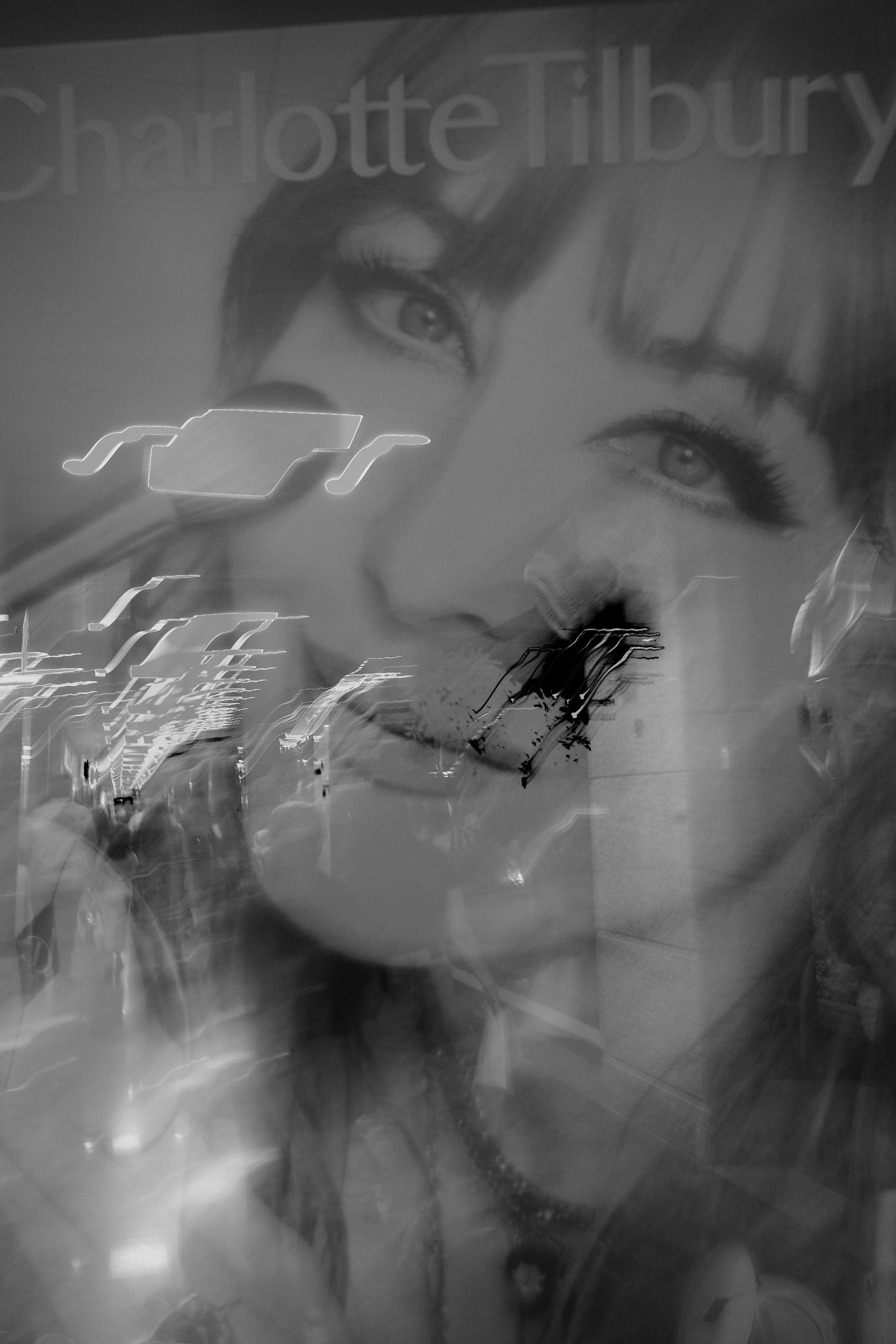 Black and white abstract portrait with blurred features.