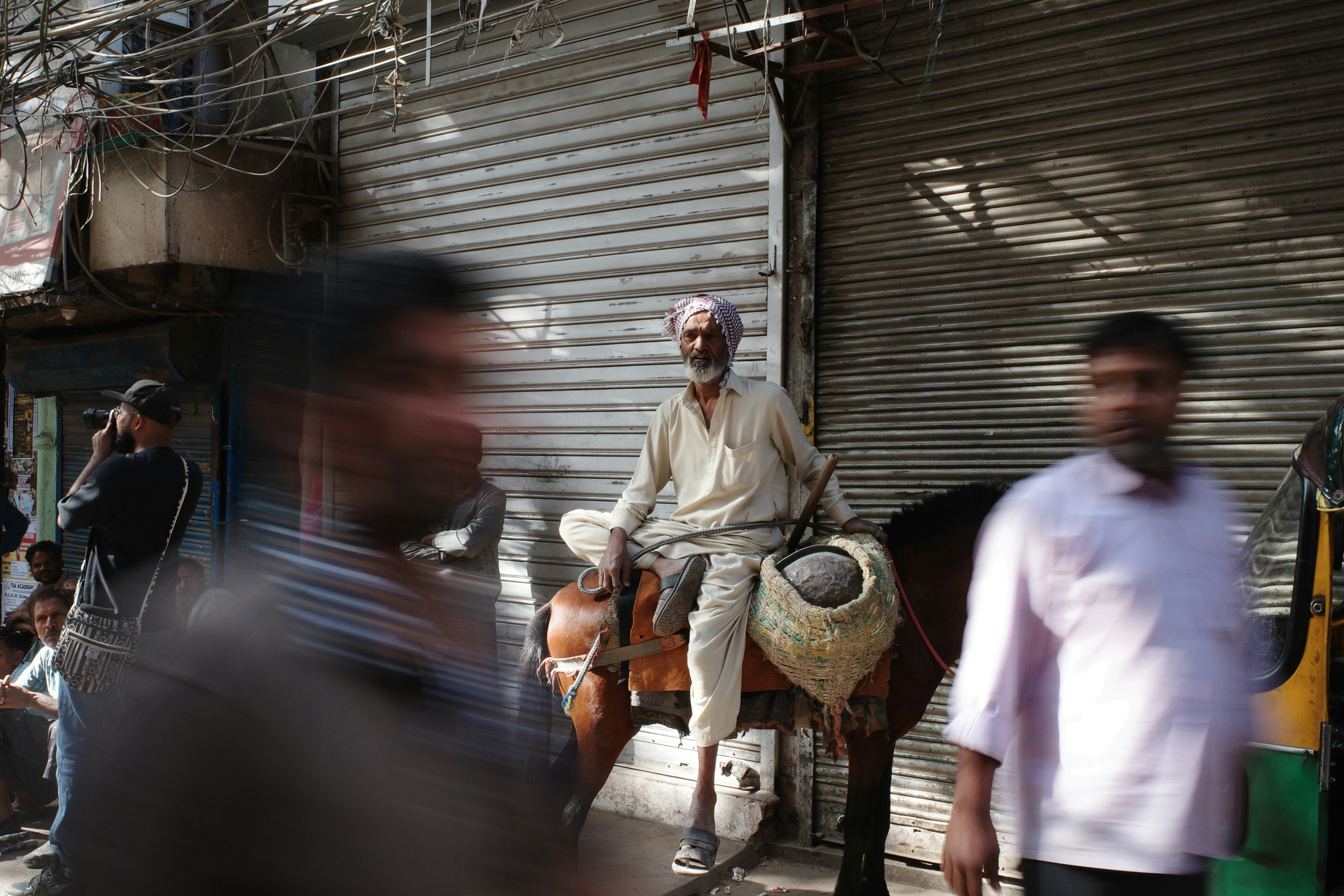 Man on horseback in a busy street