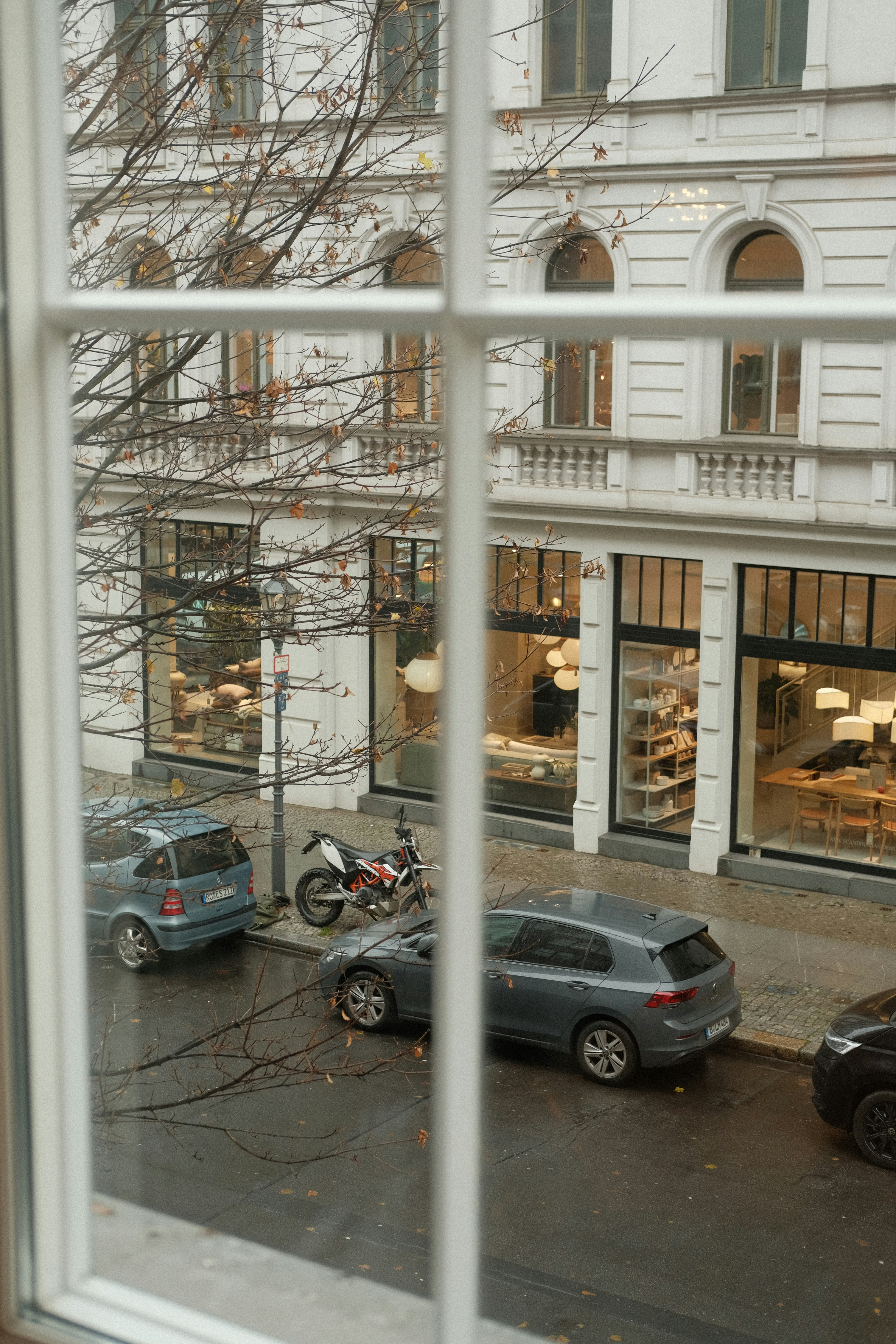 Cars parked on a street outside buildings