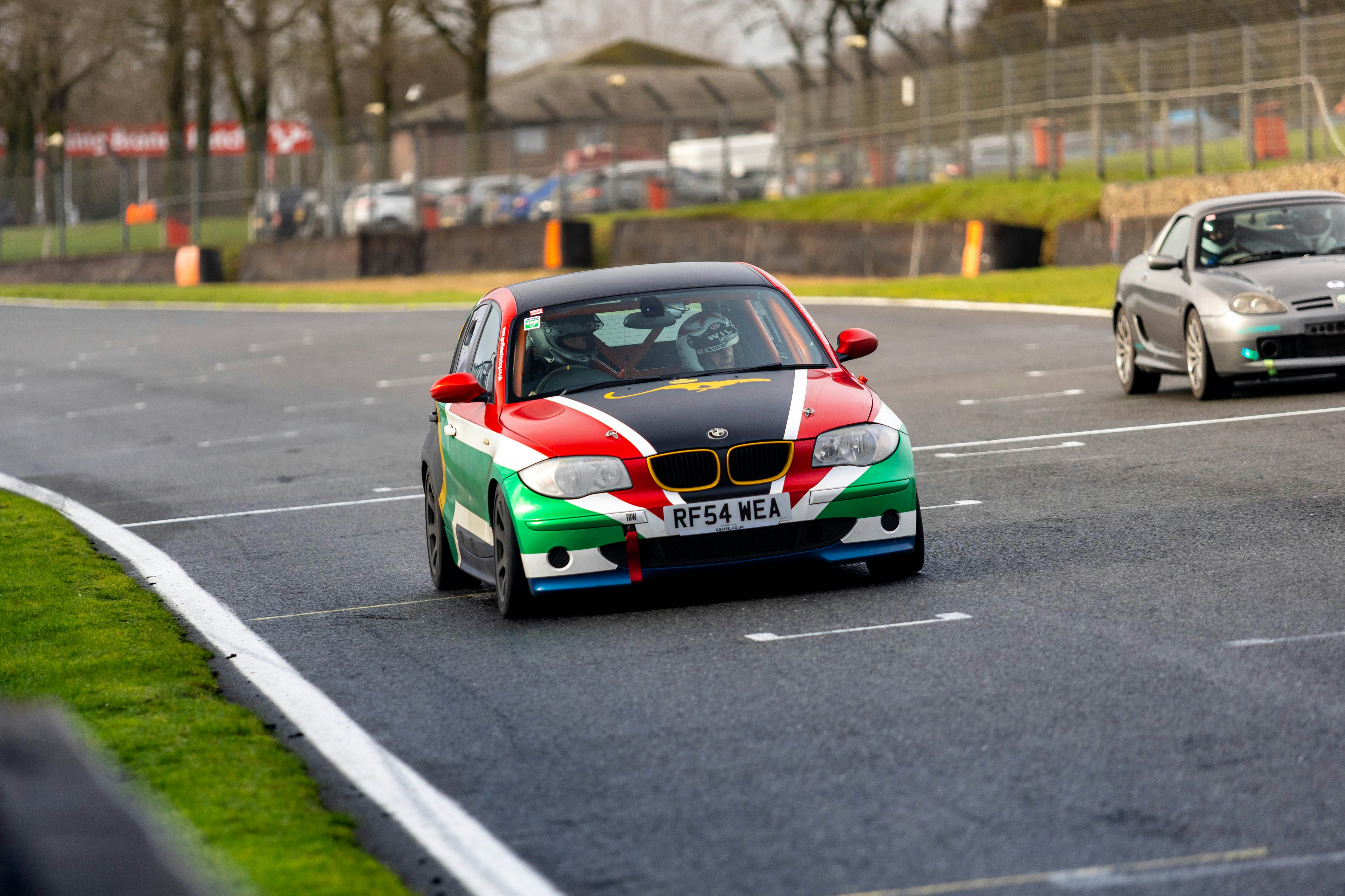 Race car with colorful livery on track photo – Free Bmw Image on Unsplash