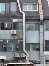 Building exterior with pipes and windows