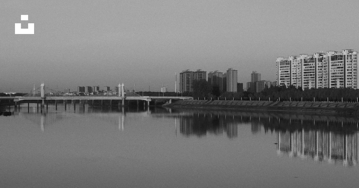 Whter Icon Modern bridge reflecting in calm water with city skyline - Free Photo ...
