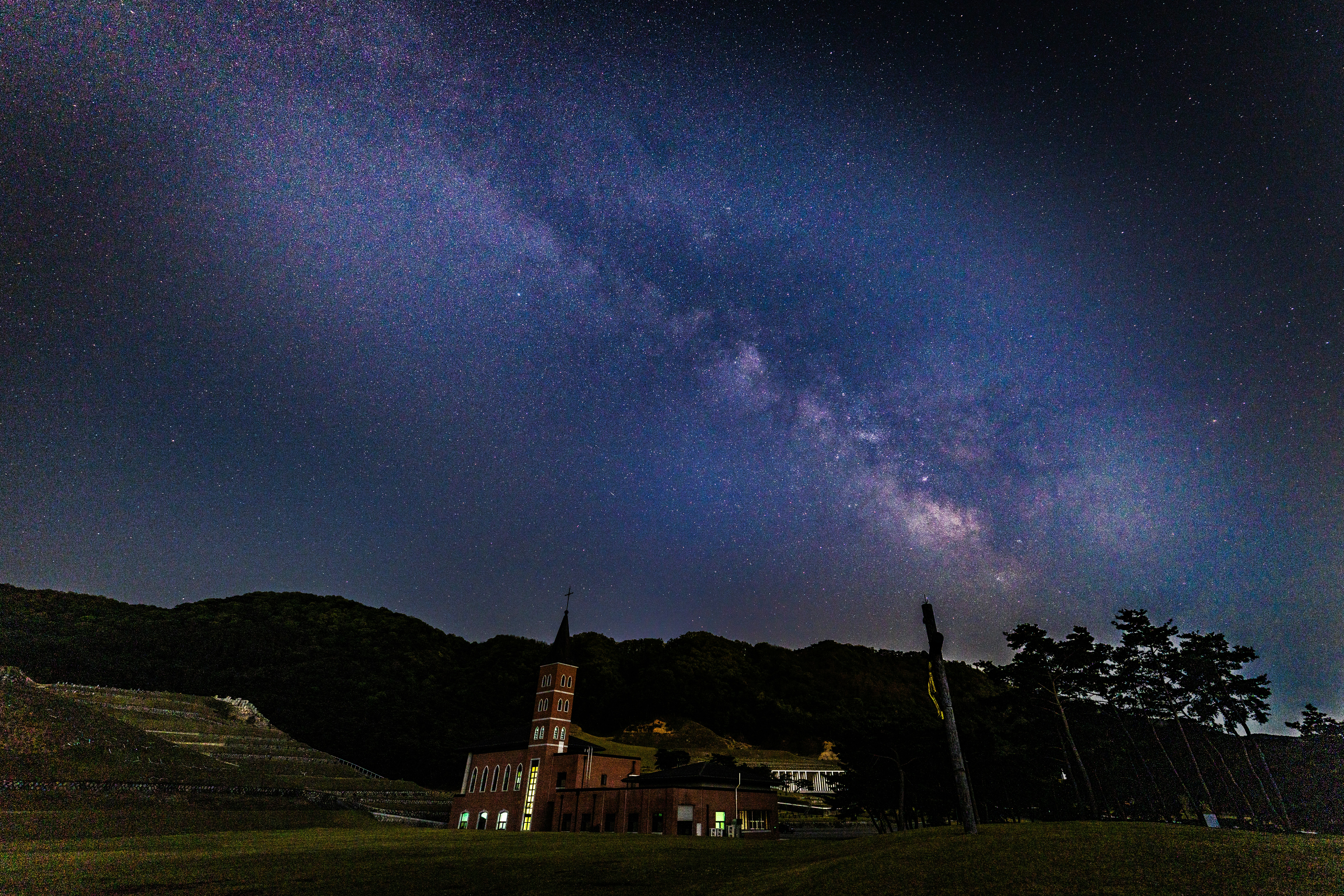 Milky way galaxy over a building at night