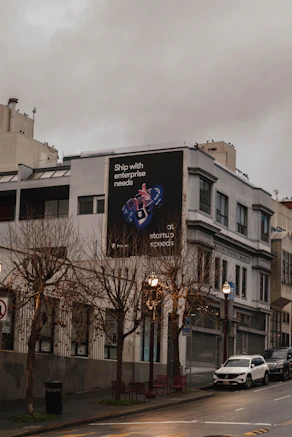 Building with a large advertisement on its side.