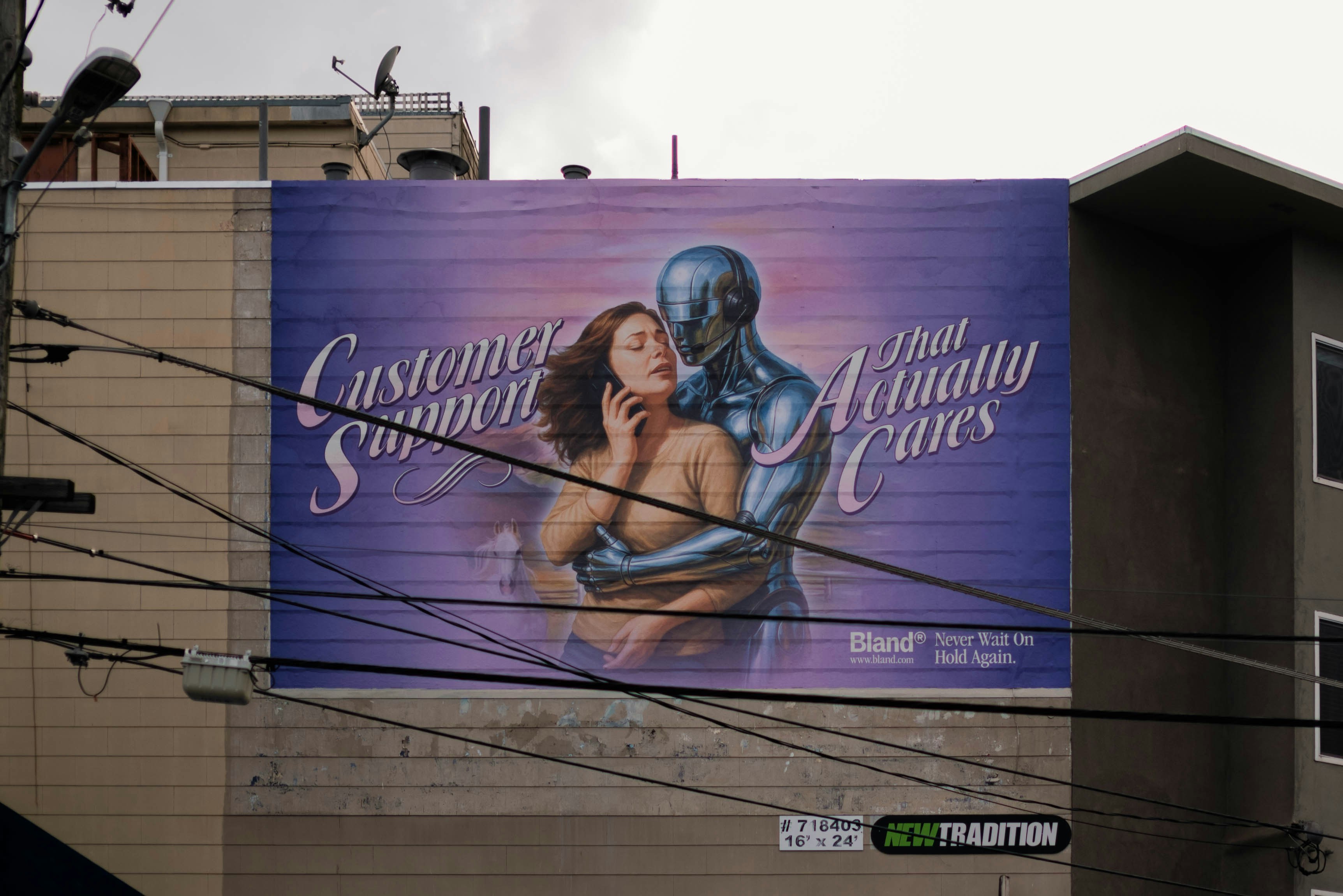 Billboard with woman and robot embracing