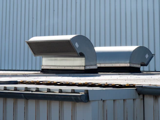 Two ventilation units on a building roof