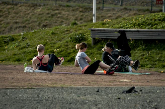 People exercising outdoors on a sunny day.