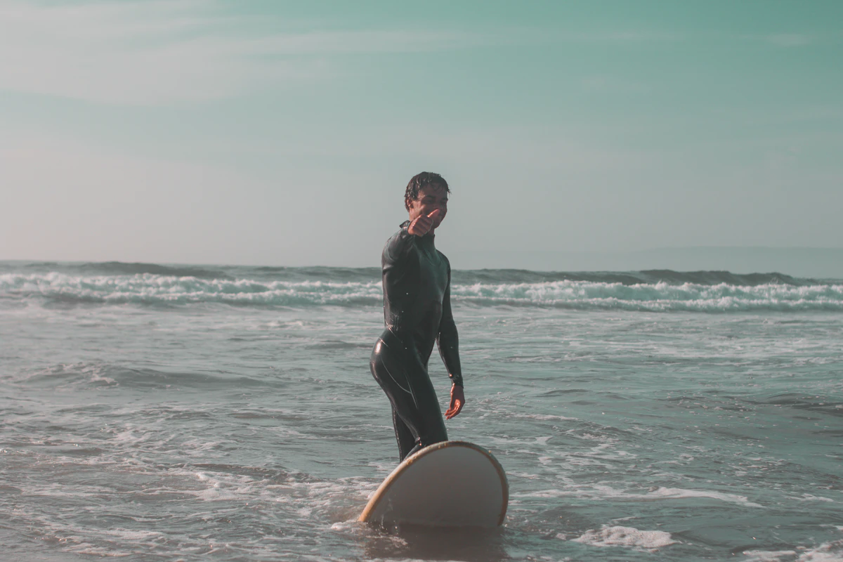 A surfer with his board in the Atlantic waves near Agadir