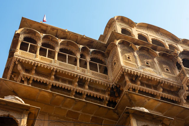 Intricate sandstone architecture against a clear blue sky